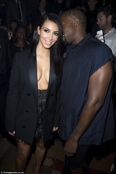 Kim Kardashian appears topless under open tuxedo jacket  